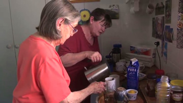 Picture:
Norma(left) is married to Karel who has a brain injury. 
He is supported by attendant carers. 
One of the carers is Lyn (right).